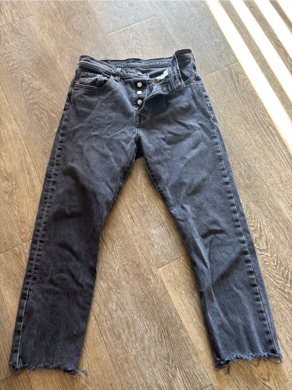 Levi's button fly 501  Black Washed Straight Jeans with Raw Hem